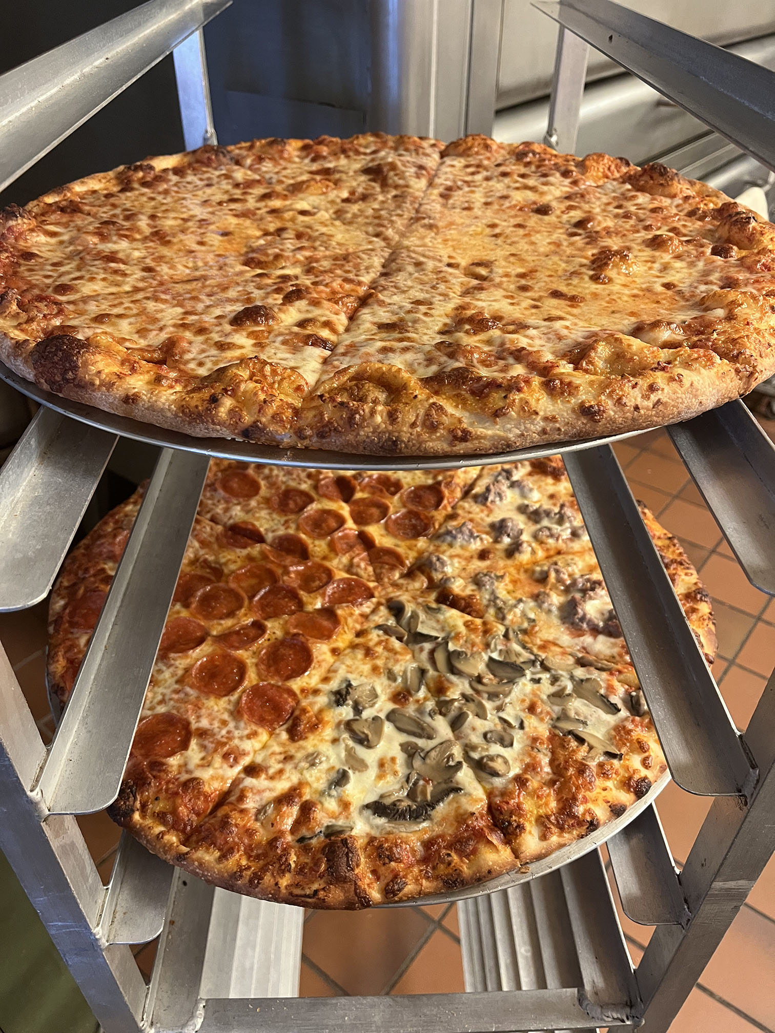 Pizzas on a rack